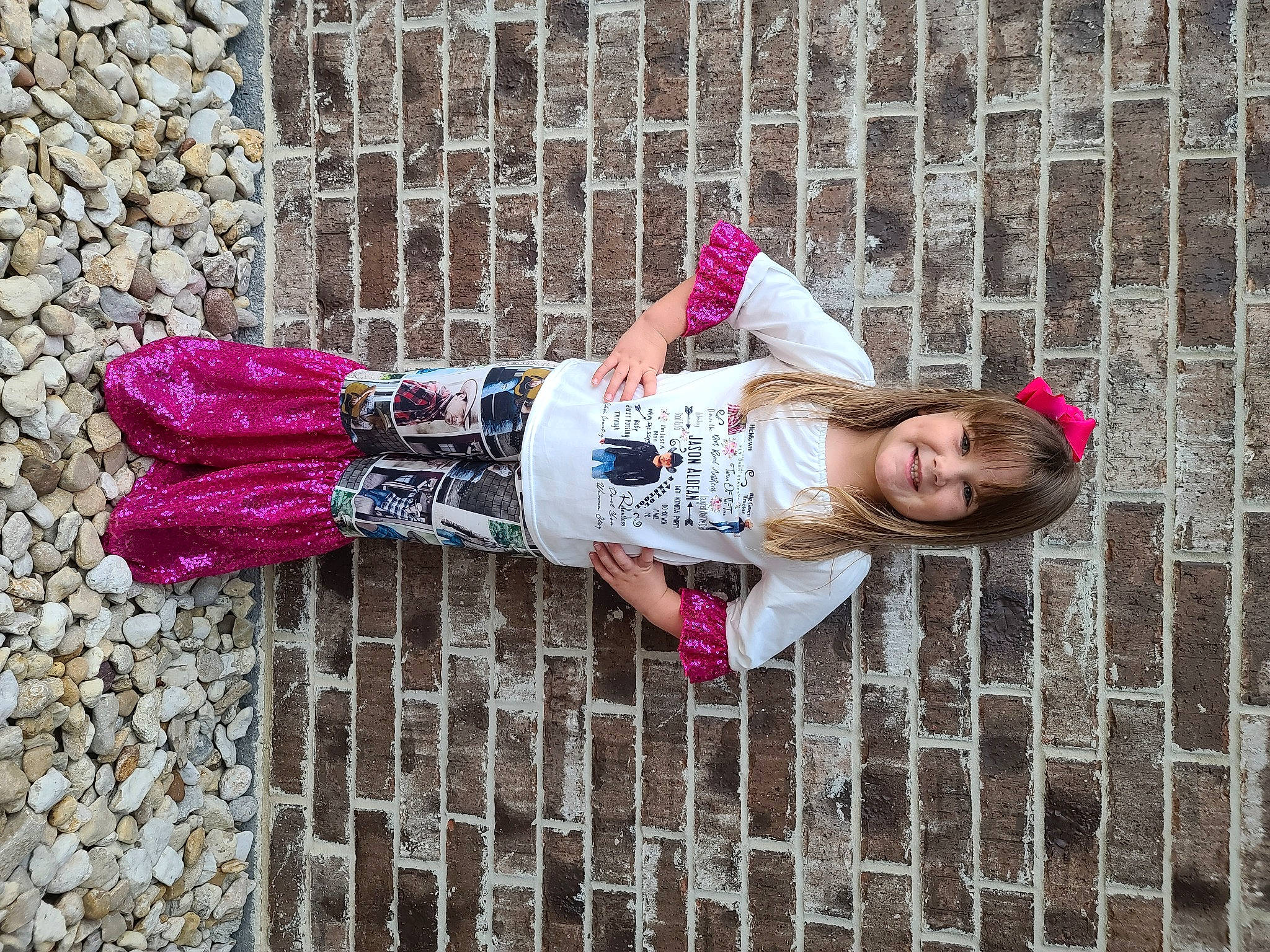 Averi joined the competition — help win amazing prizes! brick, child, clothing, dress, face, fence, fun, happy, hat, joy, magenta, pattern, person, pink, purple, red, smile, spring, street_fashion, textile