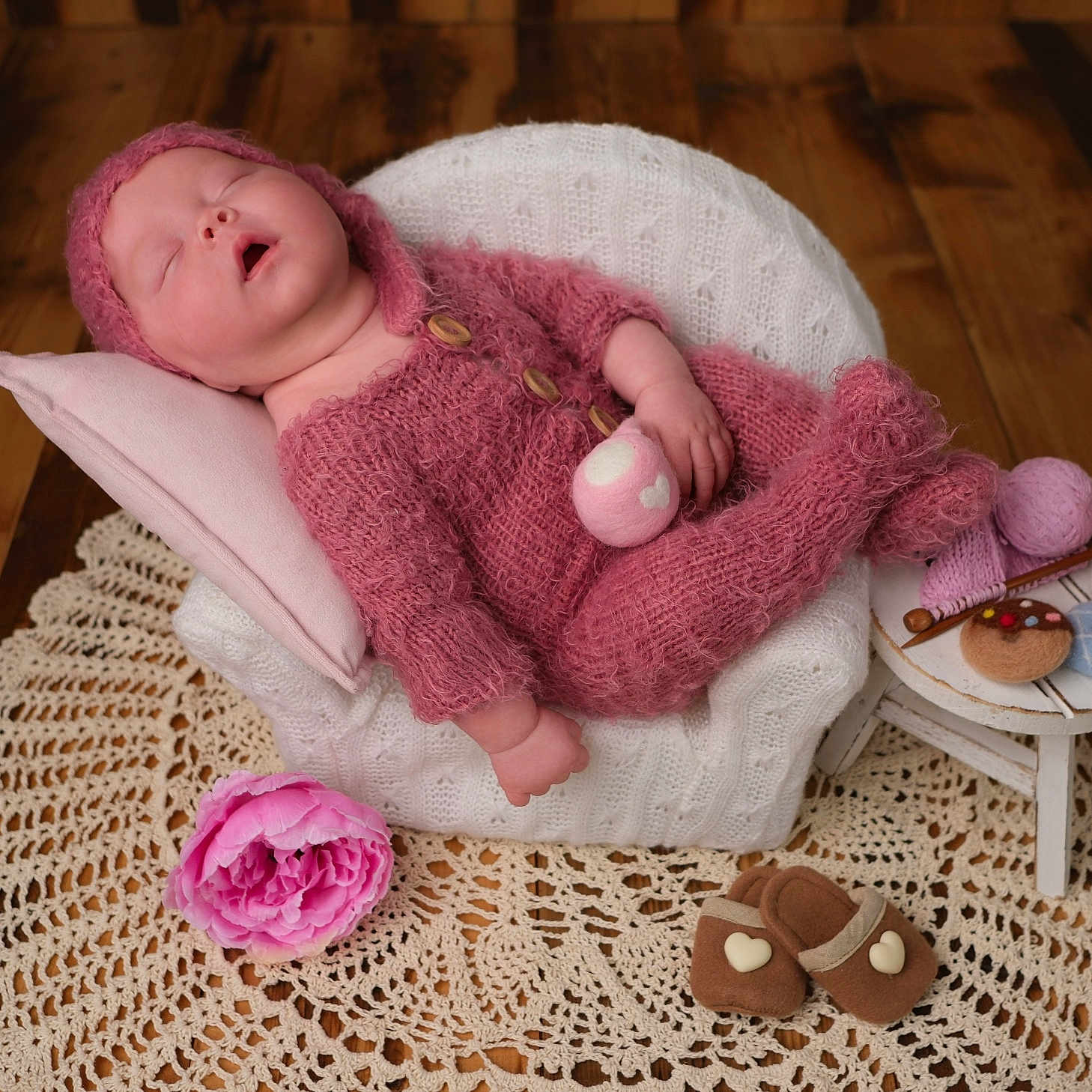 Ada-Jane is registered to the contest to win money with this photo: armchair, baby, cozy, crocheted_mat, cute, flower, handmade, infant, knitted_clothing, miniature, peaceful, pillow, pink, relaxed, sleeping, slippers, soft, table, toy, wooden_floor