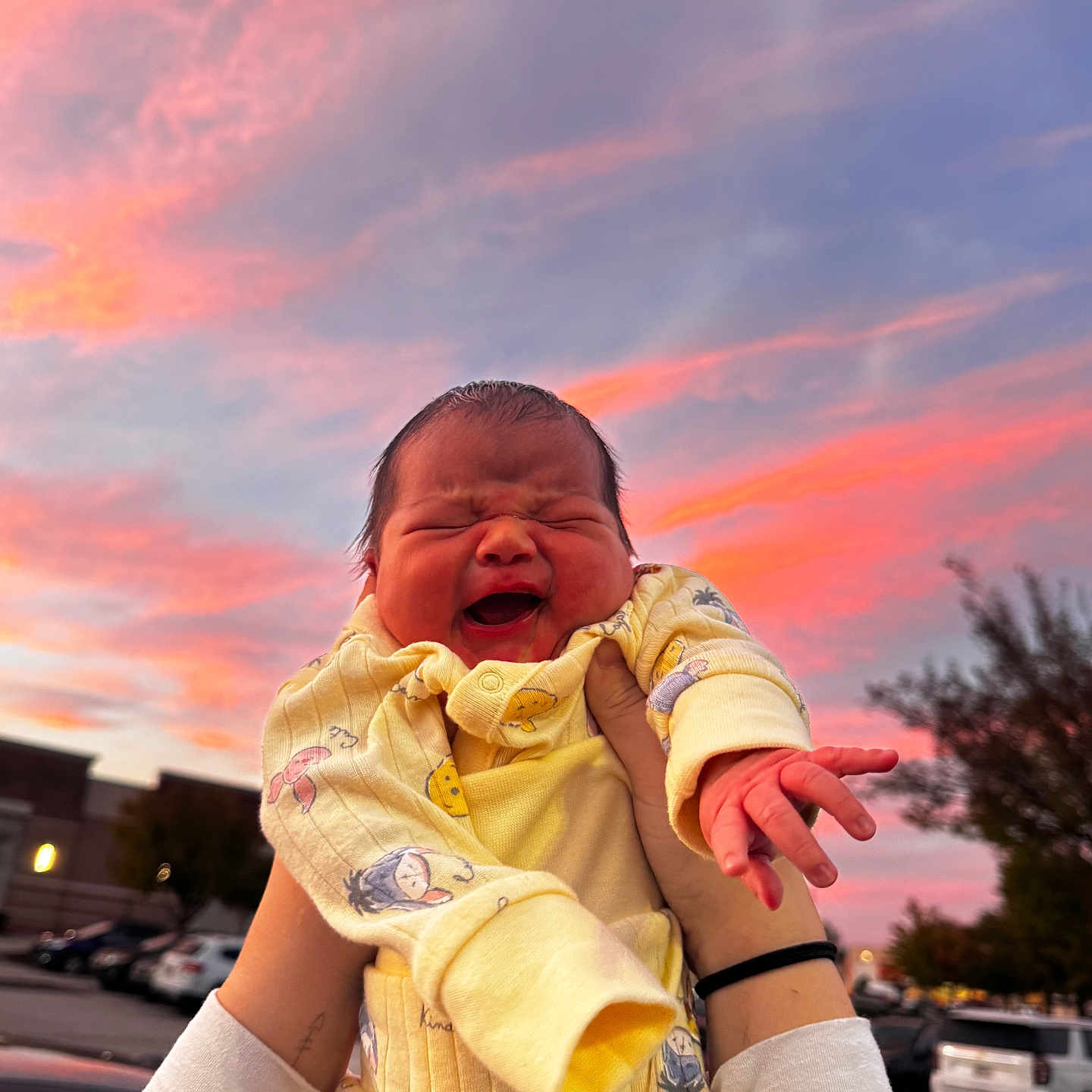 Eduardo joined the competition — help win amazing prizes! baby, cartoon_characters, clouds, colorful_sky, evening, expression, hands, happy, holding, infant, joy, nature, newborn, outdoor, person, portrait, sky, sunset, warm_colors, yellow_onesie