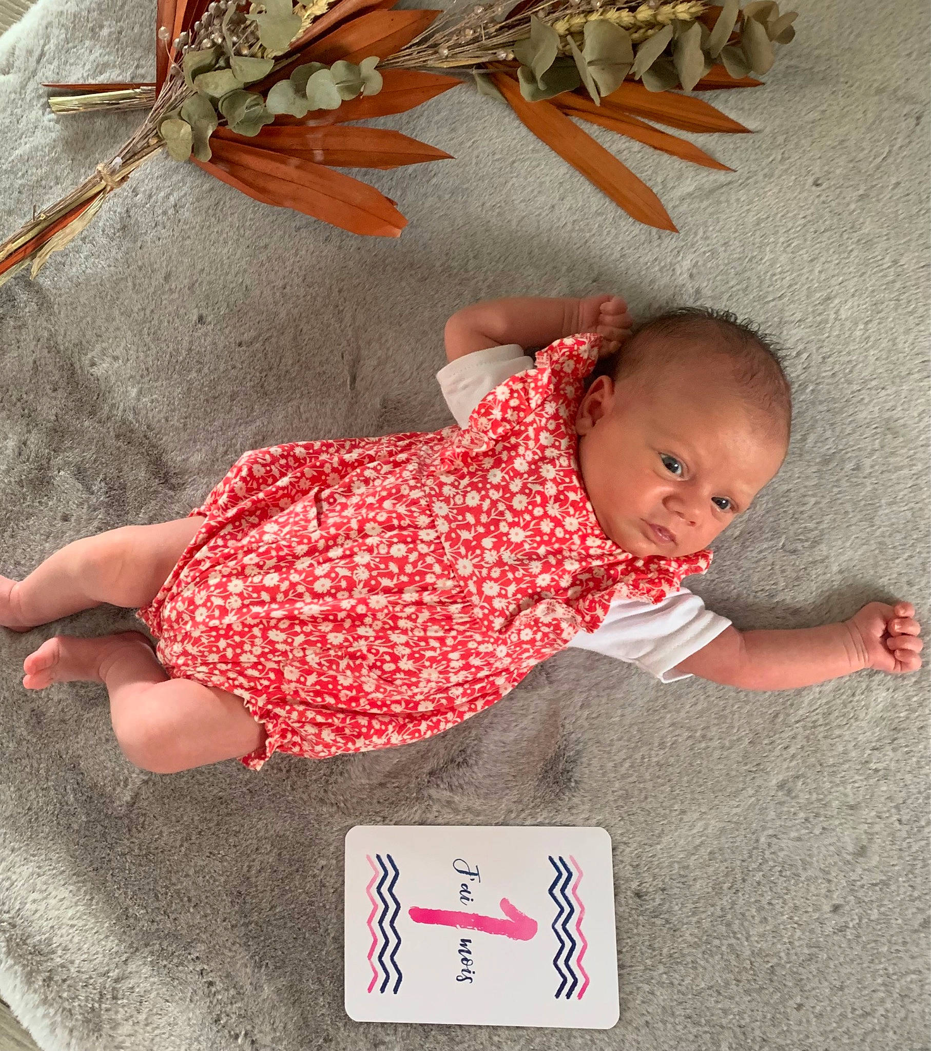 Maxine a rejoint le concours — aidez-le/la à gagner de superbes lots ! baby, baby_products, baby_sleeping, baby_toddler_clothing, baby_toys, bedding, child, comfort, flooring, foot, happy, linens, pattern, person, play, room, sleeve, sock, toddler, wood