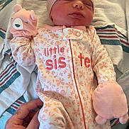 Arielle joined the competition — help win amazing prizes! baby, bed, blanket, bodypart, bonnet, cap, clothing, face, finger, furniture, glove, hand, hat, head, newborn, person, photography, portrait, quilt, sleeping