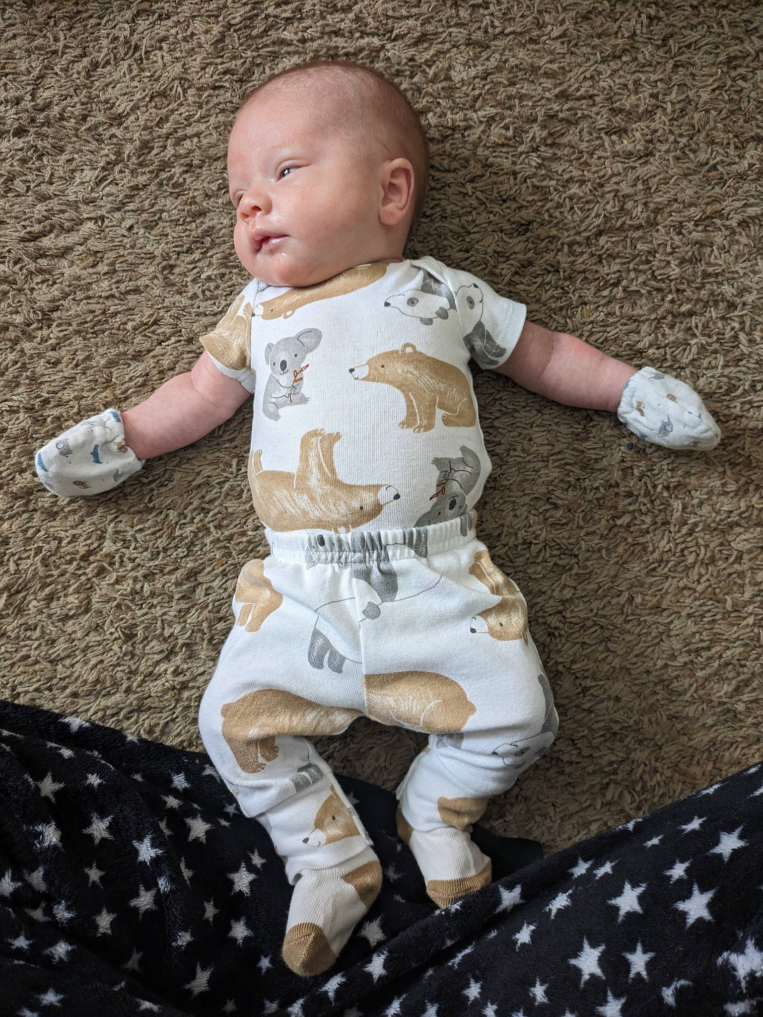 Levi joined the competition — help win amazing prizes! baby, baby_toddler_clothing, barefoot, child, comfort, flooring, foot, fun, grass, happy, human_leg, linens, pattern, person, play, sitting, sleeve, sock, thigh, toddler