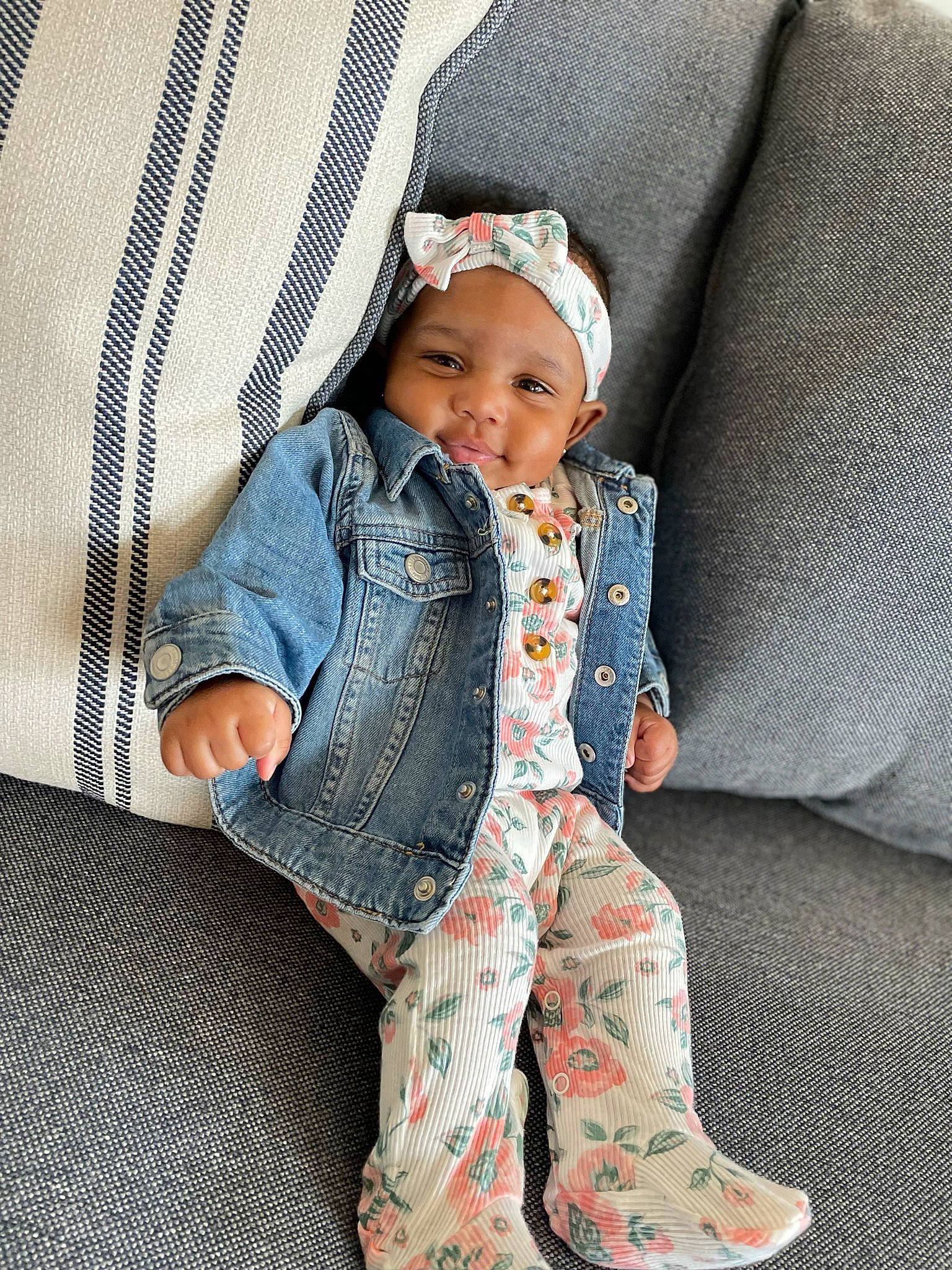Kaylani Amil joined the competition — help win amazing prizes! baby, baby_toddler_clothing, child, collar, comfort, denim, electric_blue, face, fashion_accessory, foot, grey, headwear, linens, outerwear, pattern, person, sitting, sleeve, sock, textile