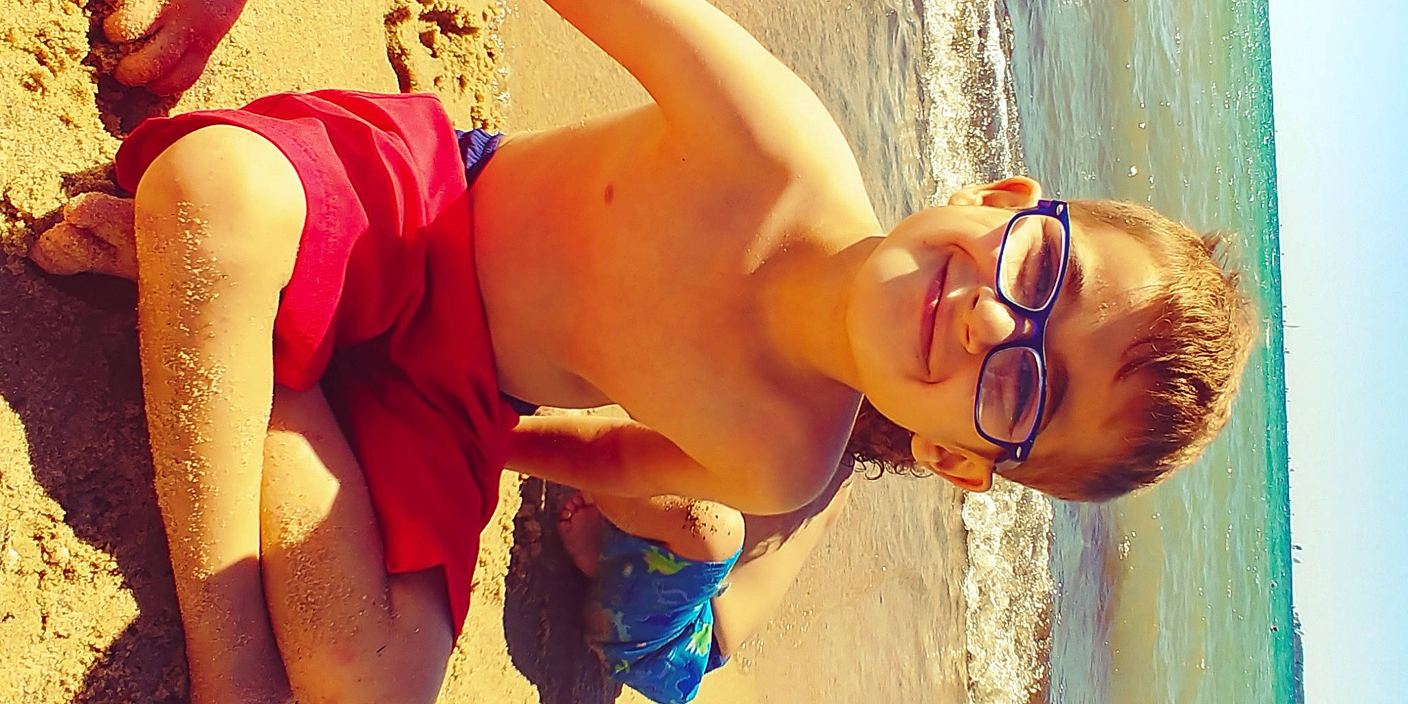 Jaden is registered to the contest to win money with this photo: beach, black_hair, brassiere, chest, eyewear, fun, happy, human_body, joy, leisure, lingerie, people_in_nature, people_on_beach, person, smile, sunglasses, sunlight, swimsuit_top, swimwear, thigh