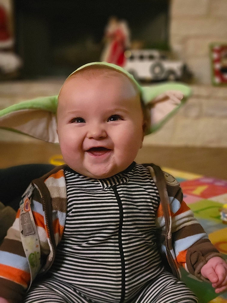 Jacob is registered to the contest to win money with this photo: baby, baby_carriage, baby_products, baby_toddler_clothing, cheek, child, event, fun, happy, head, iris, joy, laugh, pattern, people, person, room, sitting, skin, sleeve