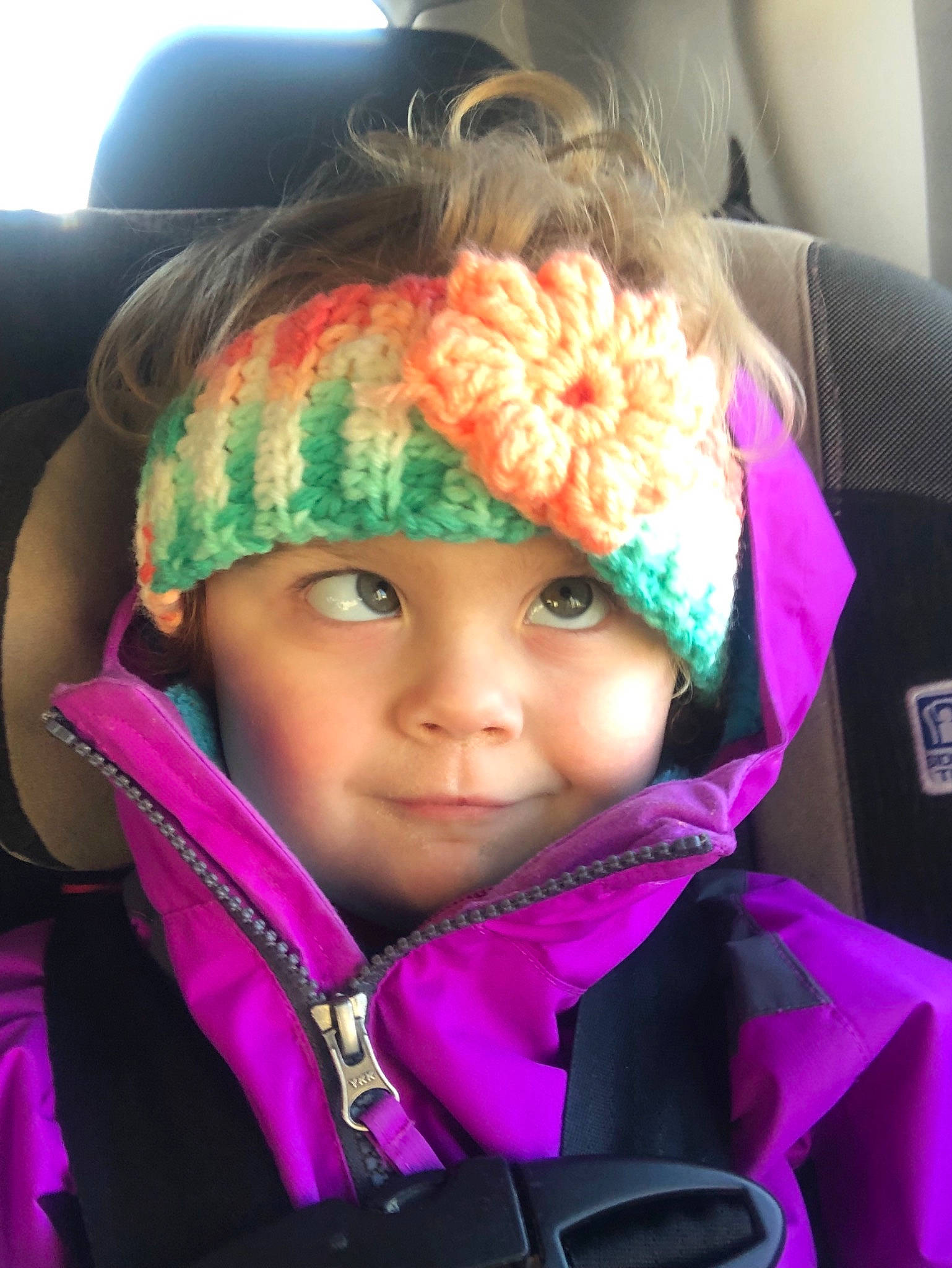 Harper is registered to the contest to win money with this photo: car_seat, cheek, child, cool, eye, face, fashion_accessory, head, headgear, magenta, person, photography, pink, smile