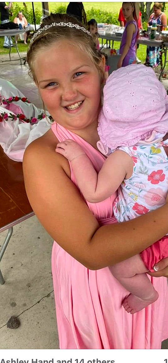 Hadleigh joined the competition — help win amazing prizes! baby_toddler_clothing, dress, finger, fun, gesture, grass, hand, happy, hat, human_body, interaction, joy, leisure, lip, magenta, person, pink, recreation, skin, smile