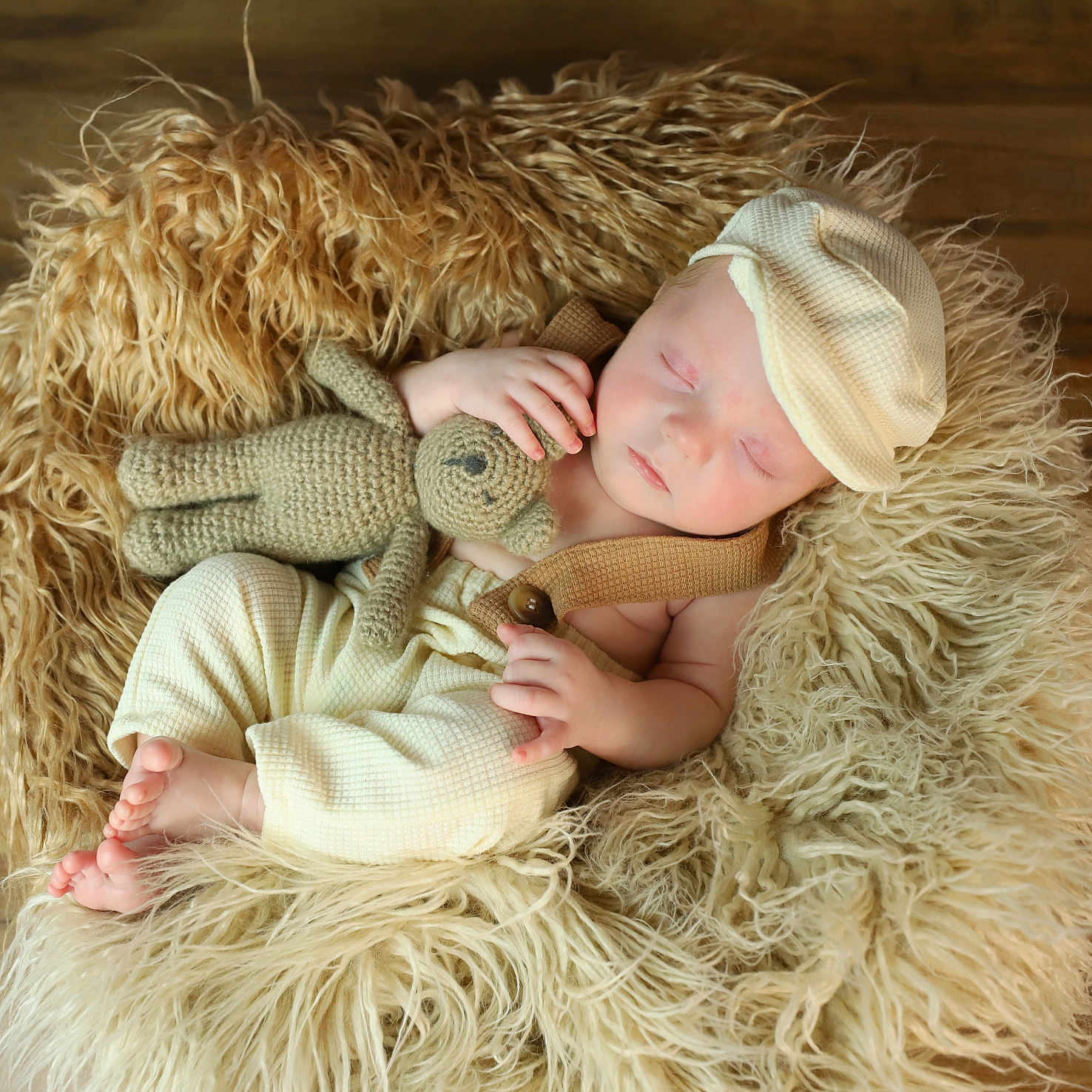 Atticus is registered to the contest to win money with this photo: baby, blanket, bonnet, cap, clothing, couch, cushion, doll, face, furniture, hat, head, homedecor, newborn, person, photography, portrait, sleeping, toy, wood