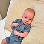 Ronnie is registered to the contest to win money with this photo: baby, blanket, clothing, couch, cushion, face, furniture, happy, head, homedecor, jeans, newborn, pants, person, photography, pillow, portrait, sitting, sleeve, smile