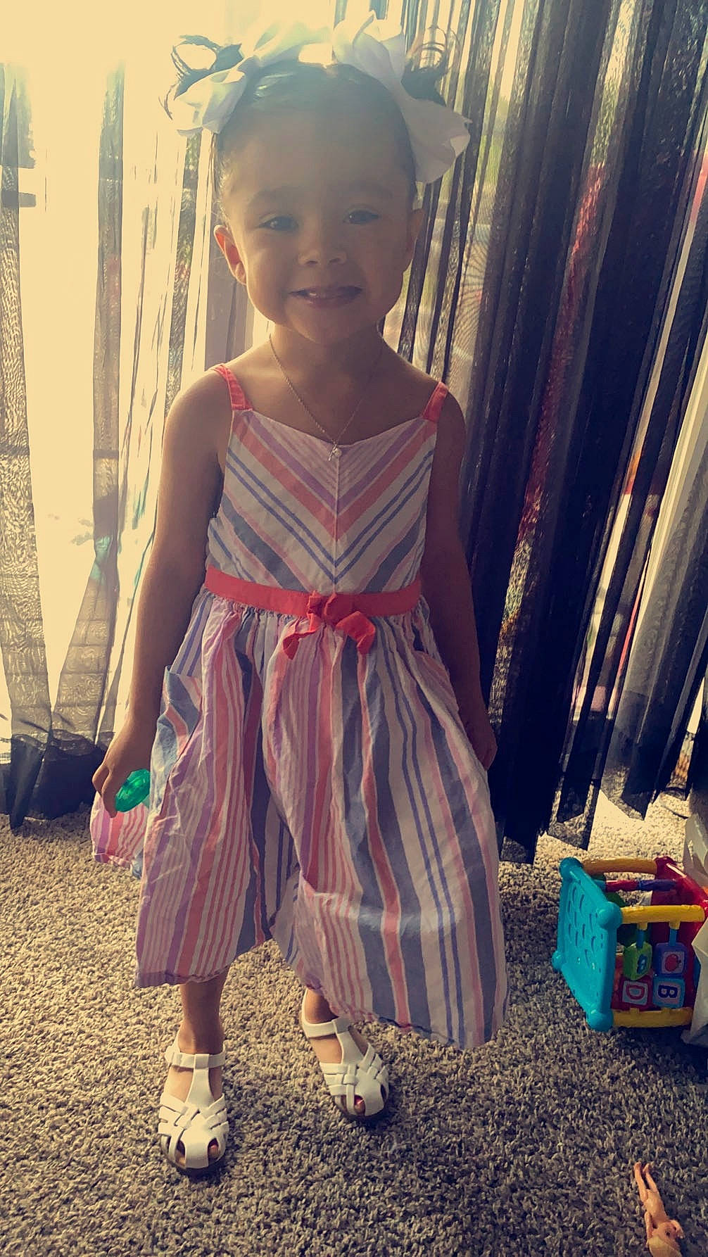 Mariela is registered to the contest to win money with this photo: baby_toddler_clothing, beauty, child, cool, day_dress, dress, face, hairstyle, happy, joy, morning, people, person, pink, skin, smile, standing, summer, tints_and_shades, toddler