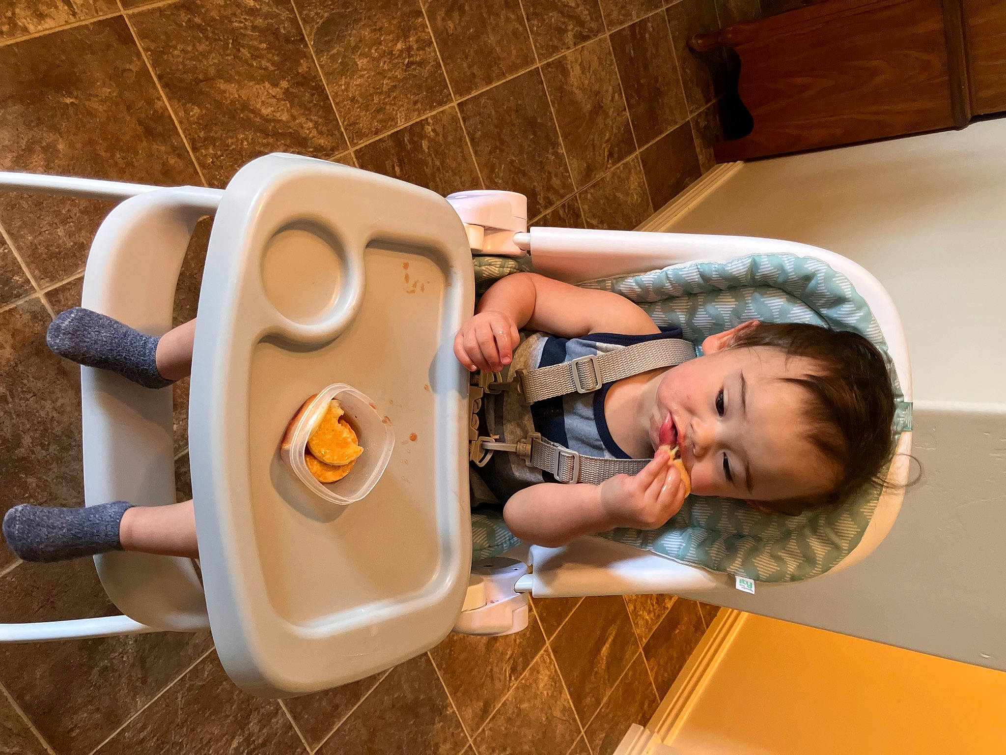 Creed is registered to the contest to win money with this photo: audio_equipment, baby, baby_products, baby_toddler_clothing, baby_toys, child, comfort, flooring, fun, happy, hardwood, leisure, machine, person, play, room, sitting, toddler, toy, vacation