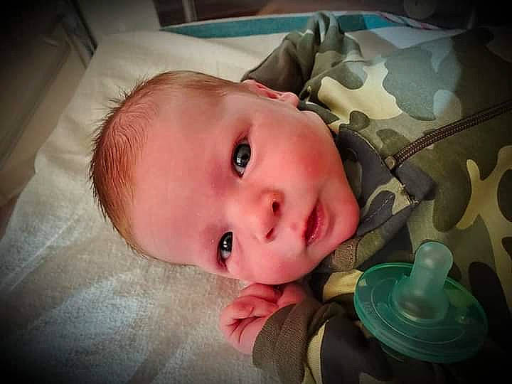 Silas is registered to the contest to win money with this photo: baby, baby_toddler_clothing, cheek, child, comfort, eye, eyebrow, eyelash, flash_photography, fun, head, iris, lip, mouth, nose, person, skin, smile, toddler, tree