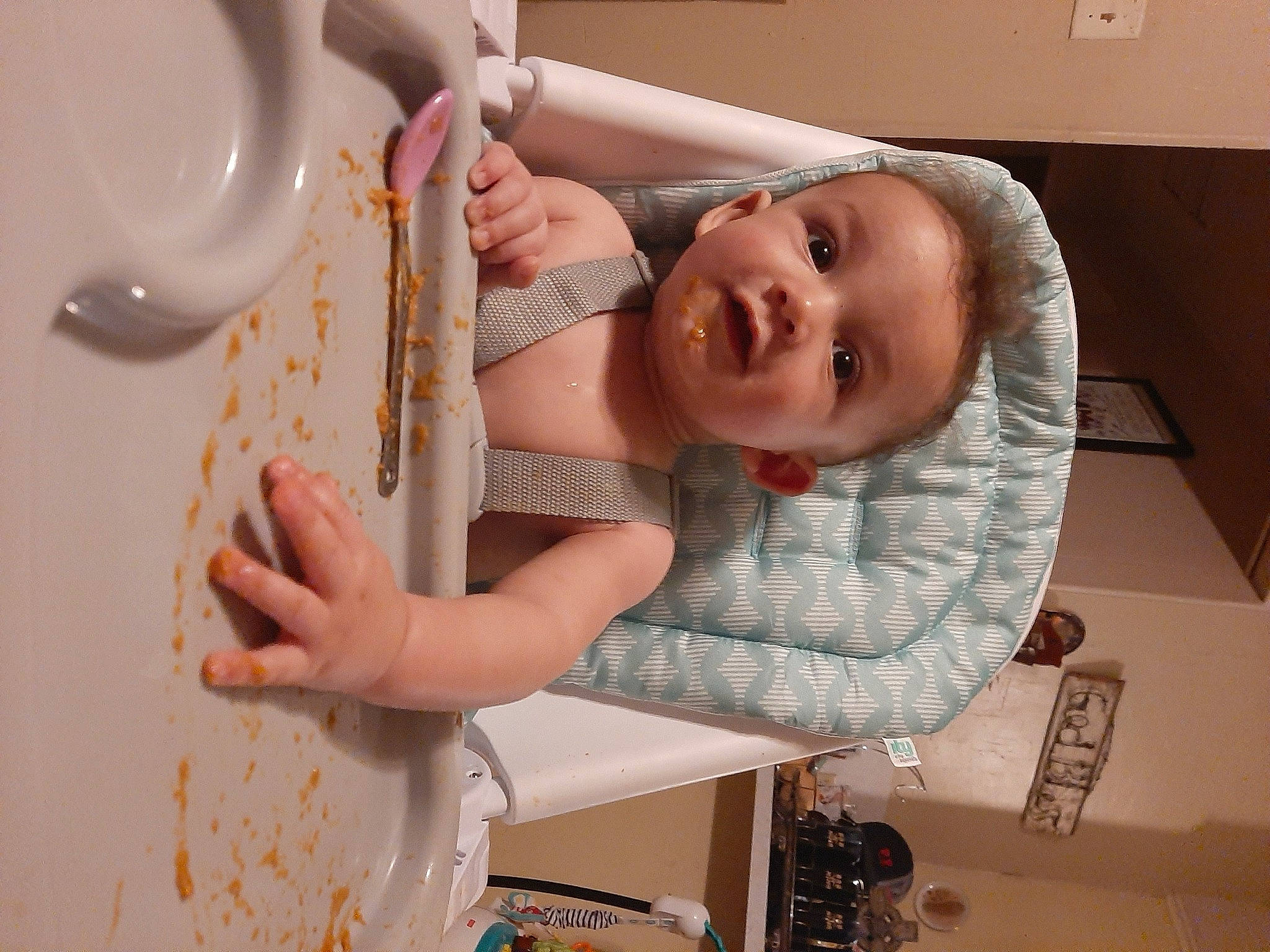 Jim is registered to the contest to win money with this photo: baby, baby_products, baby_toddler_clothing, chair, child, finger, food, fun, hand, happy, pattern, person, plate, play, room, serveware, sitting, smile, t_shirt, tableware