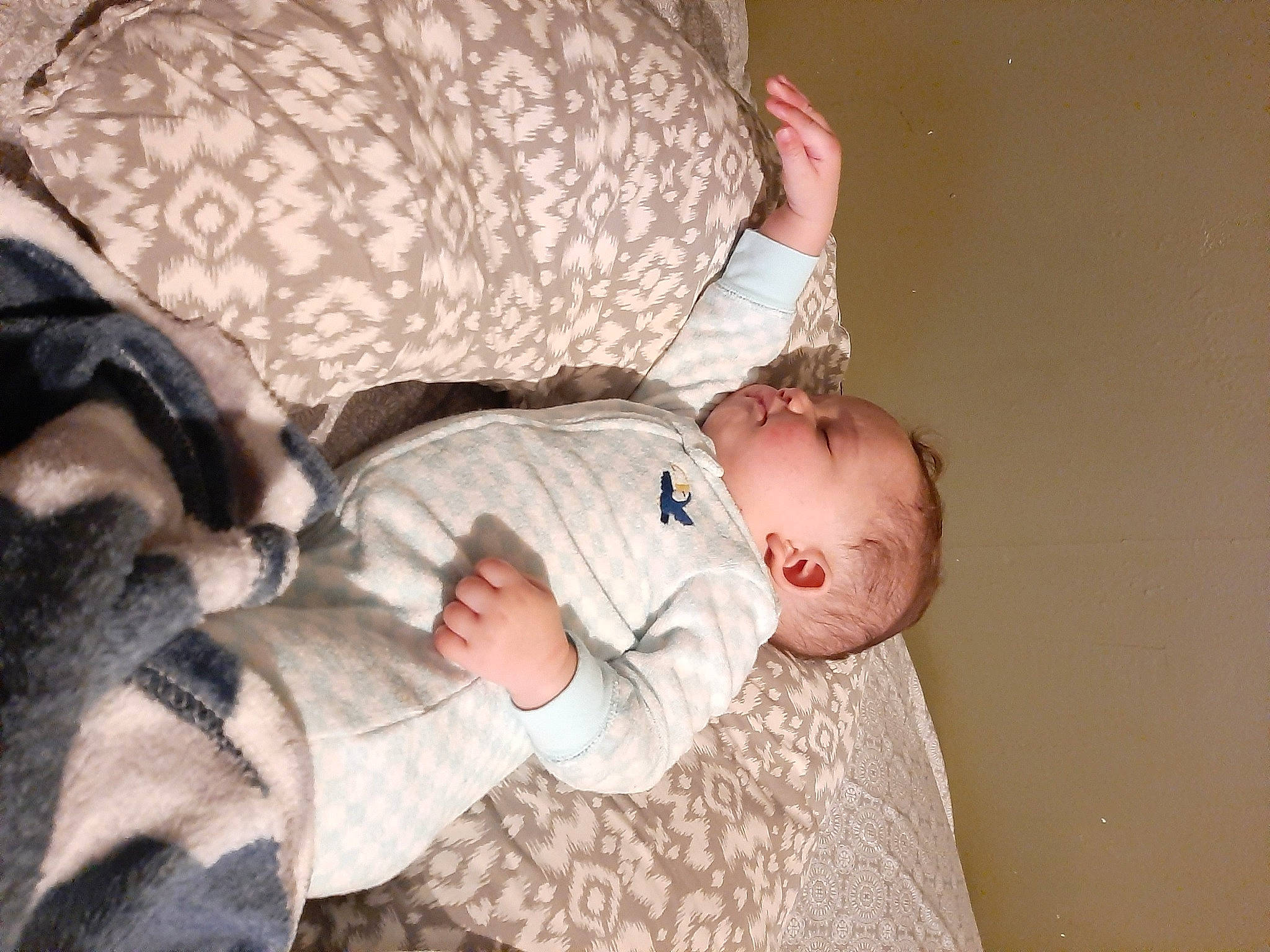 Jim is registered to the contest to win money with this photo: baby, baby_products, baby_toddler_clothing, bedtime, child, comfort, elbow, gesture, glasses, interaction, nap, pattern, person, room, sitting, sleep, sleeve, toddler, tree