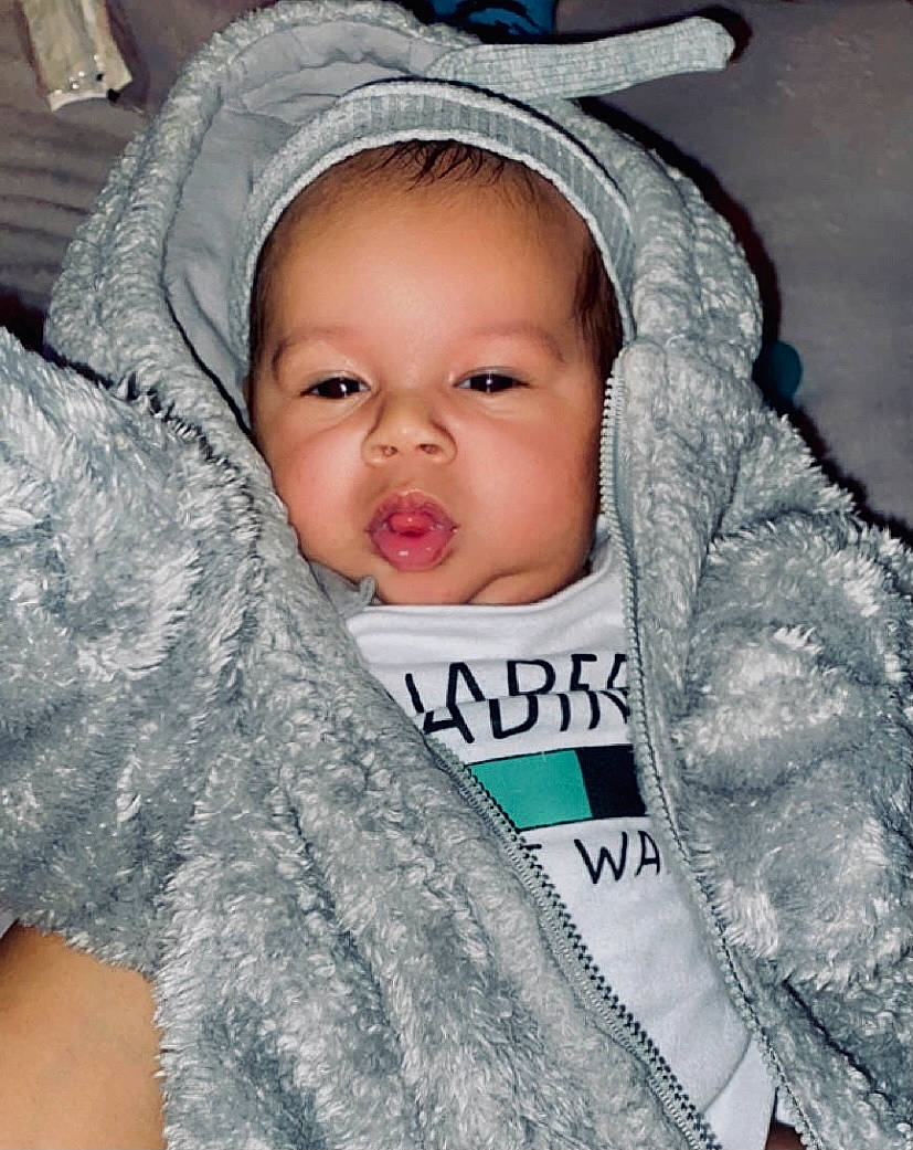 Josiah is registered to the contest to win money with this photo: baby, baby_products, baby_toddler_clothing, beauty, cap, cheek, child, comfort, fashion_accessory, fun, fur, happy, iris, nose, person, skin, sleeve, smile, textile, toddler