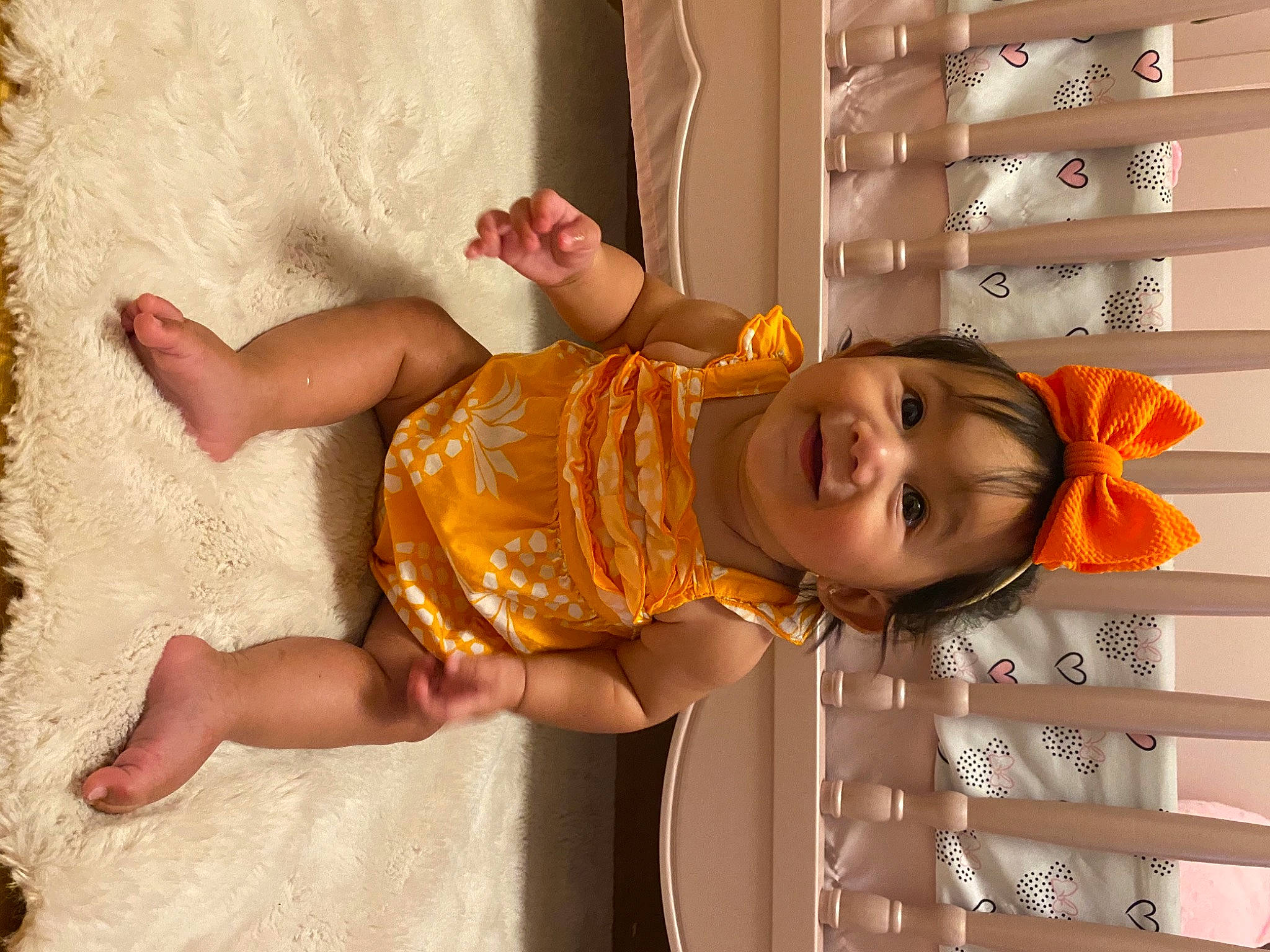 Thalia Estrella is registered to the contest to win money with this photo: arm, baby, baby_toddler_clothing, child, dress, facial_expression, fun, happy, human_body, joy, orange, pattern, person, pink, product, skin, smile, snapshot, summer, textile
