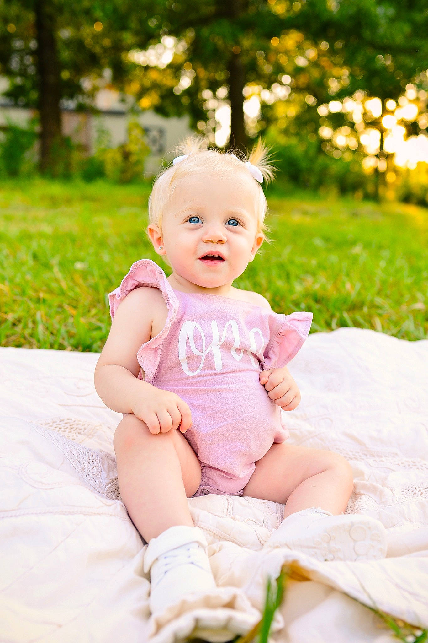 Blakely joined the competition — help win amazing prizes! baby, baby_toddler_clothing, child, eye, flash_photography, fun, grass, happy, hat, head, headband, headpiece, people_in_nature, person, pink, plant, sitting, skin, smile, toddler