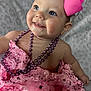baby, child, pink_dress, headband, bow, beads, smiling, blue_eyes, portrait, cute, infant, closeup, happy, fashion, accessories, soft_blanket, indoors, skin, face, person
