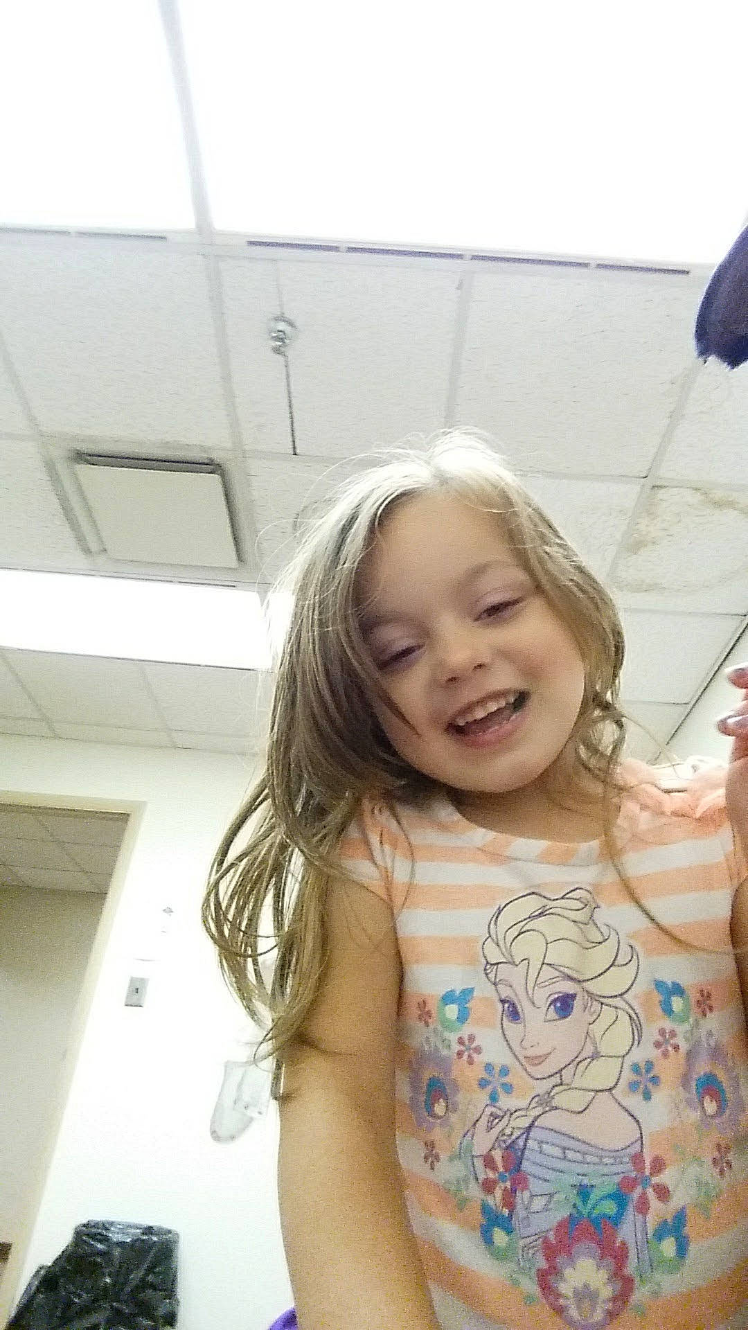 Jayden is registered to the contest to win money with this photo: blond, chest, child, fun, happy, joy, laugh, leisure, pattern, person, portrait_photography, room, shoulder, sitting, skin, smile, t_shirt, toddler, vacation