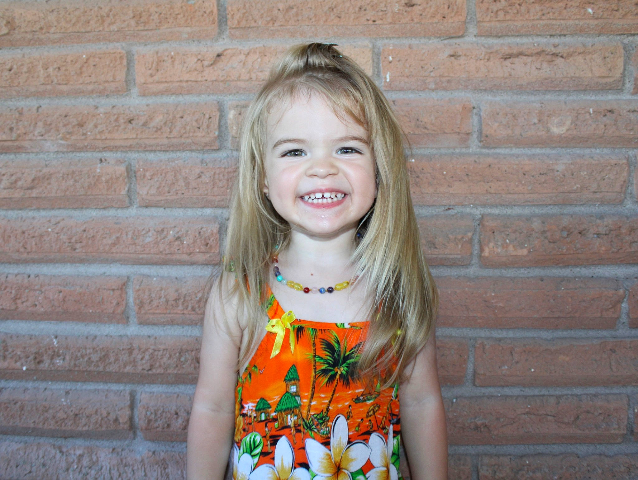 Alexia is registered to the contest to win money with this photo: cool, dress, eye, facial_expression, fawn, hair, happy, head, iris, joy, lip, neck, orange, outerwear, person, photograph, pink, plant, skin, sleeve