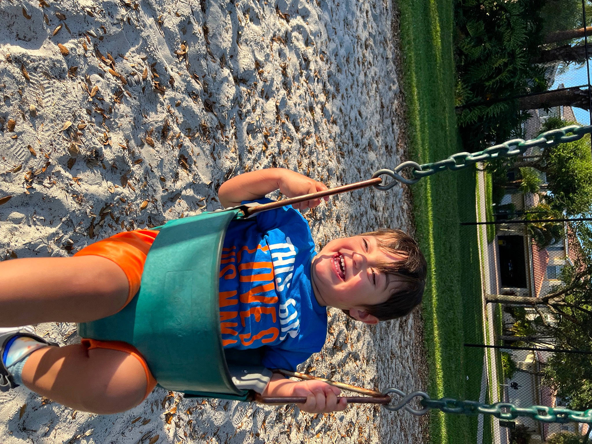 Mason is registered to the contest to win money with this photo: adventure, child, denim, elbow, electric_blue, fun, grass, happy, human_leg, landscape, leisure, people_in_nature, person, recreation, rock, rope, t_shirt, thigh, tree, trunk