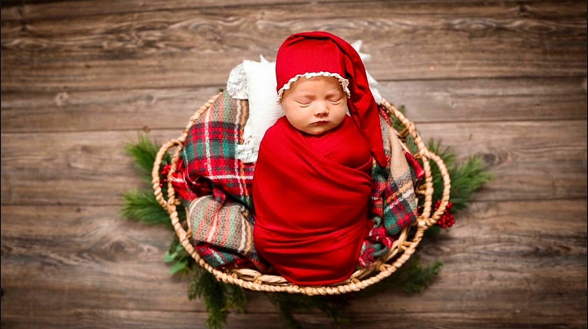 Hensley joined the competition — help win amazing prizes! baby, eye, flash_photography, fun, grass, happy, head, headwear, human_body, knit_cap, outerwear, pattern, people_in_nature, person, plaid, sitting, tartan, toddler, tree, wood
