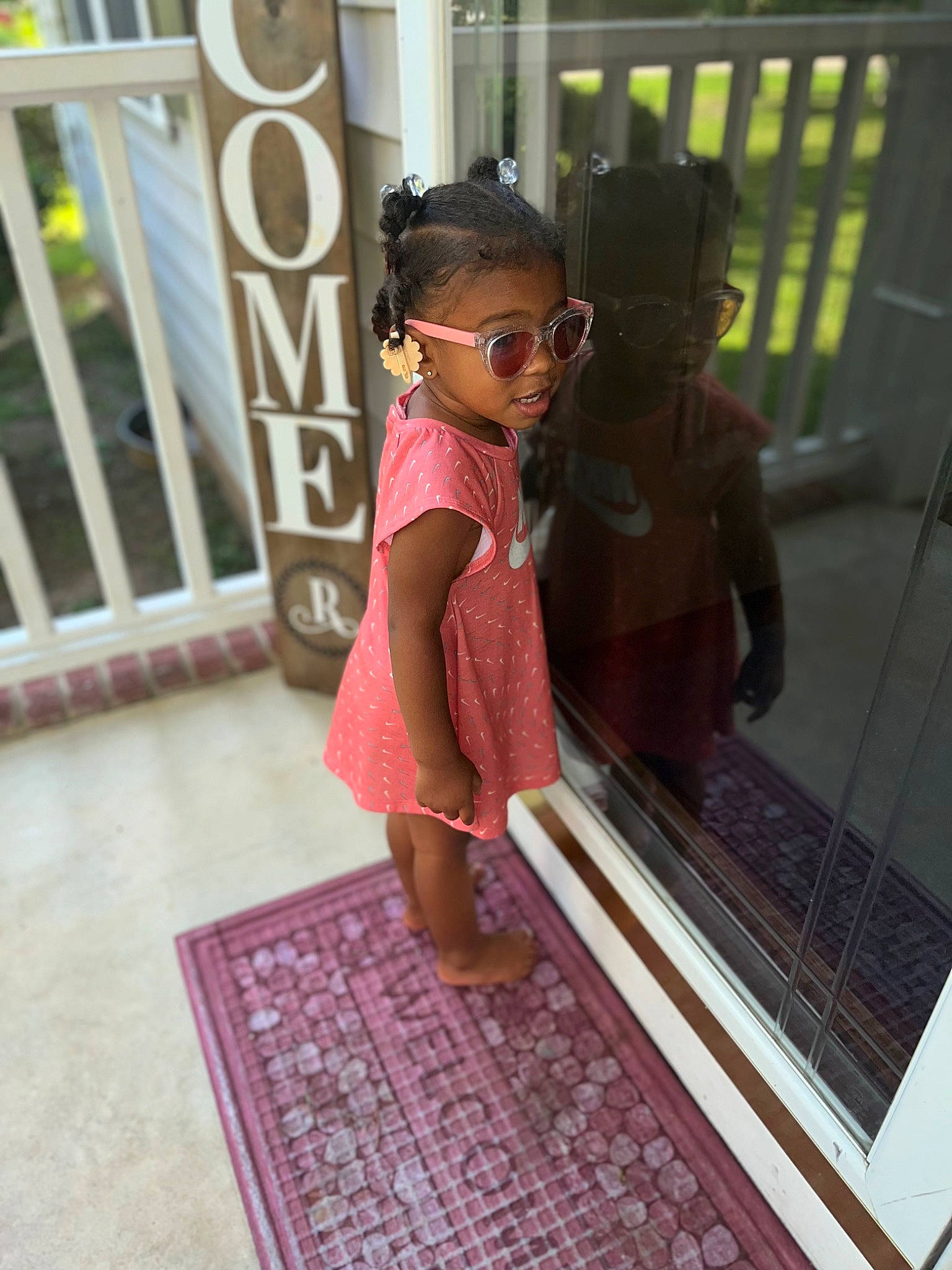 Kalani joined the competition — help win amazing prizes! bag, carpet, child, eyewear, fashion_design, floor, flooring, fun, goggles, hardwood, leisure, magenta, mat, metal, pattern, person, room, sidewalk, sunglasses, toddler