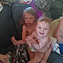 Summer is registered to the contest to win money with this photo: baby, toddler, child, couch, indoor, smile, happy, barefoot, diaper, messy_hair, clothing, person, furniture, blanket, home, skin, face, sitting, expression, casual