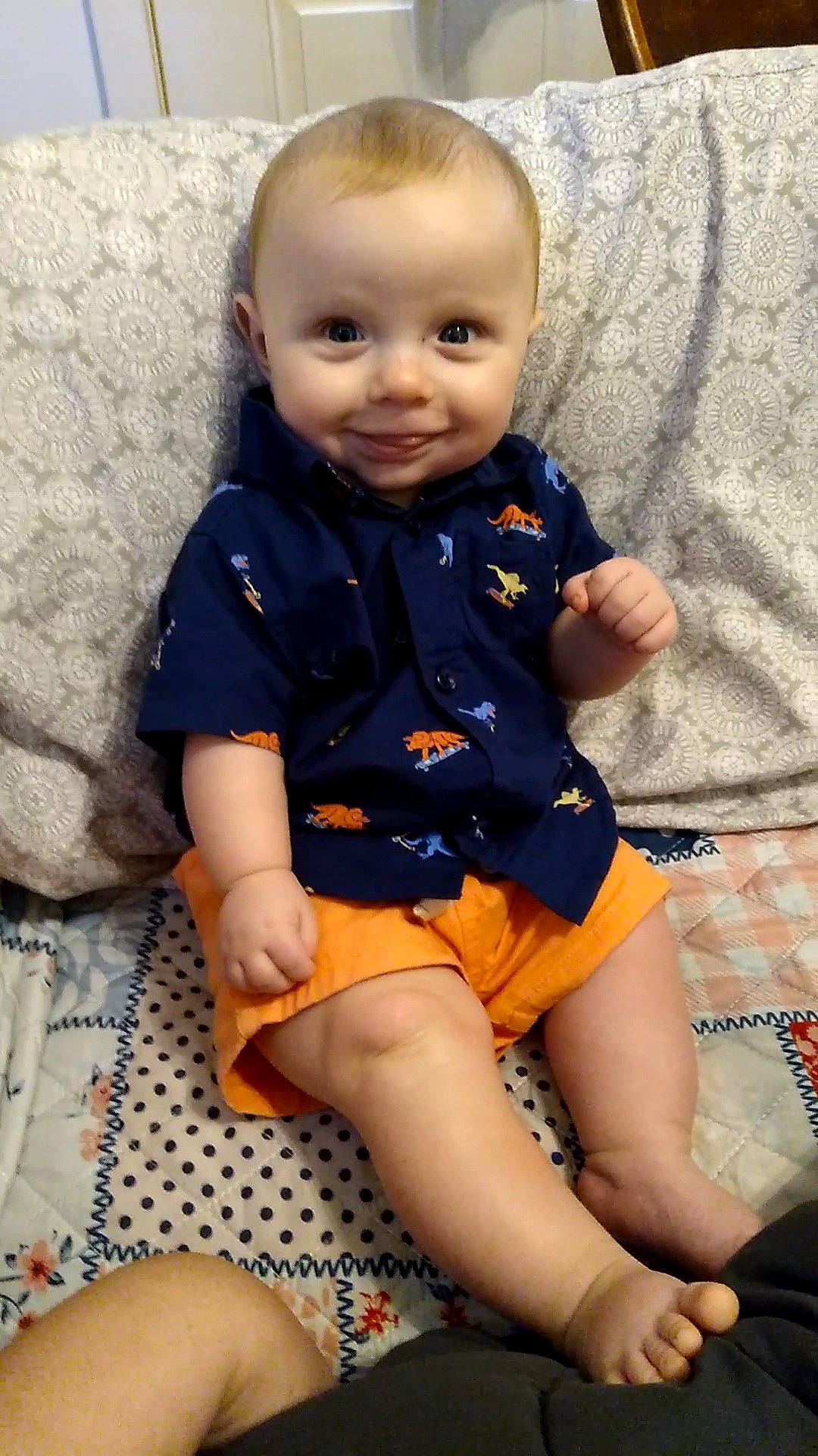 Eli James is registered to the contest to win money with this photo: baby, baby_toddler_clothing, cheek, child, chin, eye, face, happy, human_body, iris, joint, knee, leg, neck, person, skin, sleeve, smile, textile, thigh