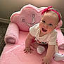 Ashley is registered to the contest to win money with this photo: baby, child, pink, headband, socks, crawling, happy, smiling, indoor, carpet, chair, plush, person, cute, toddler, white_shirt, playful, light, wall, floor