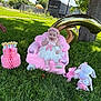 baby, child, pink_dress, pink_bow, plush_chair, stuffed_animals, balloon, number_six, grass, tree, outdoor, sunny, smiling, happy, headband, park, toy, celebration, birthday, cute