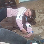 Buster joined the competition — help win amazing prizes! child, dog, pet, cuddling, sleeping, indoors, carpet, floor, home, cozy, friendship, animal, brown_dog, long_hair, pink_clothing, casual, portrait, living_room, furniture, family