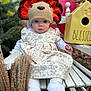 Natalie is registered to the contest to win money with this photo: baby, child, crocheted_hat, turkey_hat, white_socks, floral_dress, bench, birdhouse, autumn, outdoor, greenery, fall, decor, cute, portrait, seasonal, happy, festive, hat, sitting