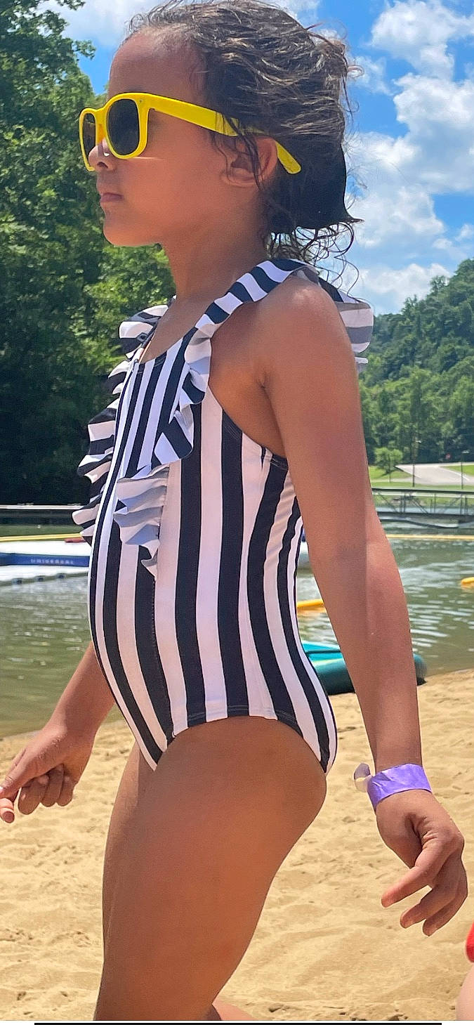 Elin is registered to the contest to win money with this photo: chest, eyewear, fun, joint, leotard, lingerie, lingerie_top, maillot, muscle, neck, one_piece_swimsuit, person, shoulder, standing, swimsuit_top, swimwear, thigh, tree, waist, water