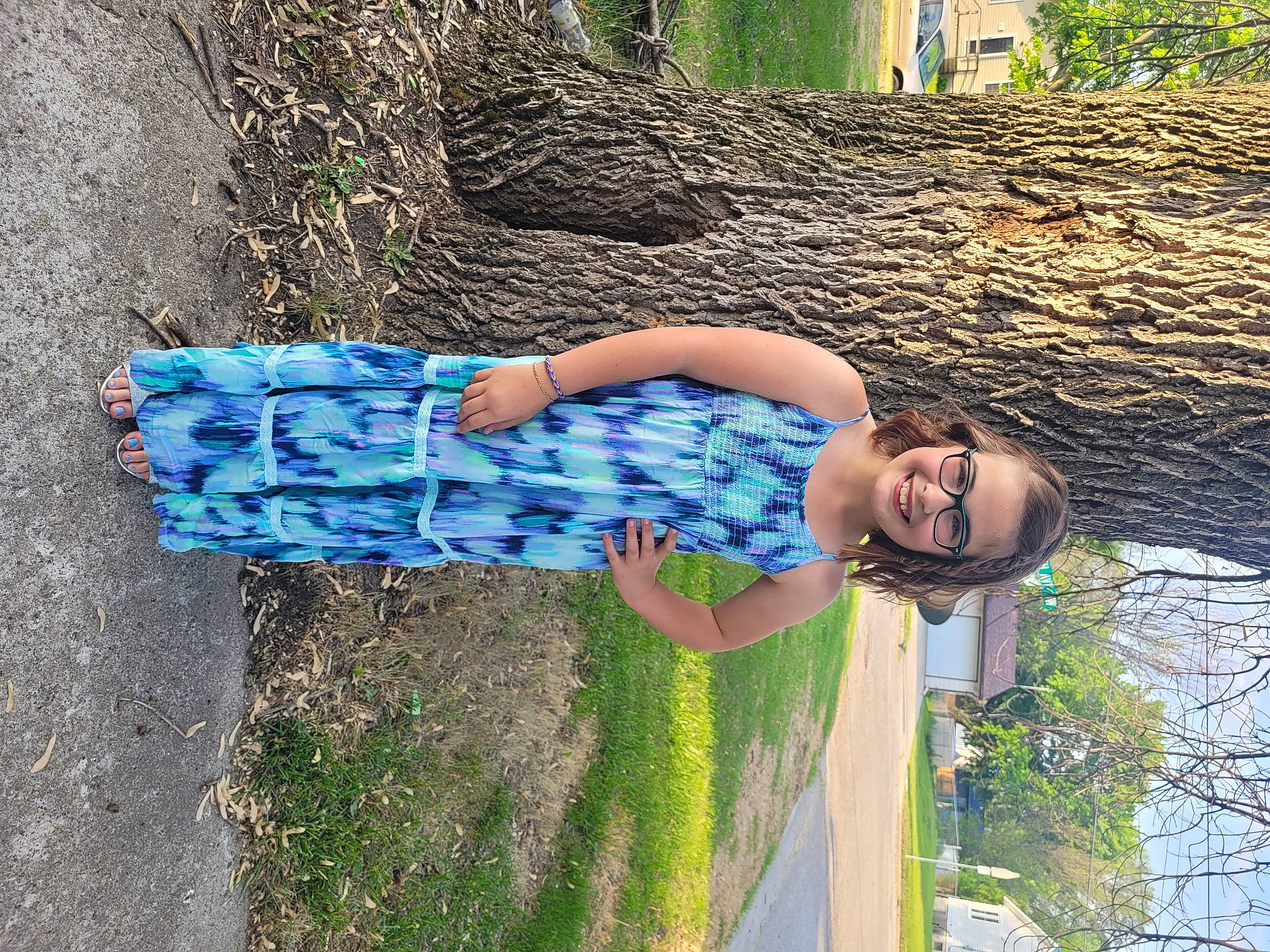 Kennedy is registered to the contest to win money with this photo: denim, electric_blue, eyewear, fun, grass, green, happy, human_leg, joy, leisure, pattern, people_in_nature, person, plant, smile, soil, thigh, tree, trunk, waist