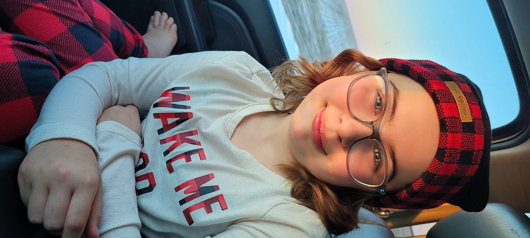 Kennedy is registered to the contest to win money with this photo: black_hair, comfort, cool, elbow, eyelash, eyewear, forehead, fun, grass, happy, headwear, joint, joy, leisure, lip, long_hair, mouth, neck, nose, person