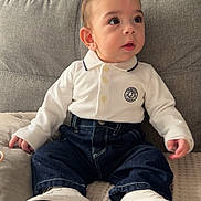 Anas a rejoint le concours — aidez-le/la à gagner de superbes lots ! baby, child, polo_shirt, jeans, shoes, tommy_hilfiger, couch, indoor, portrait, cute, fashion, soft_lighting, sitting, curious, infant, clothing, footwear, face, young_child, home