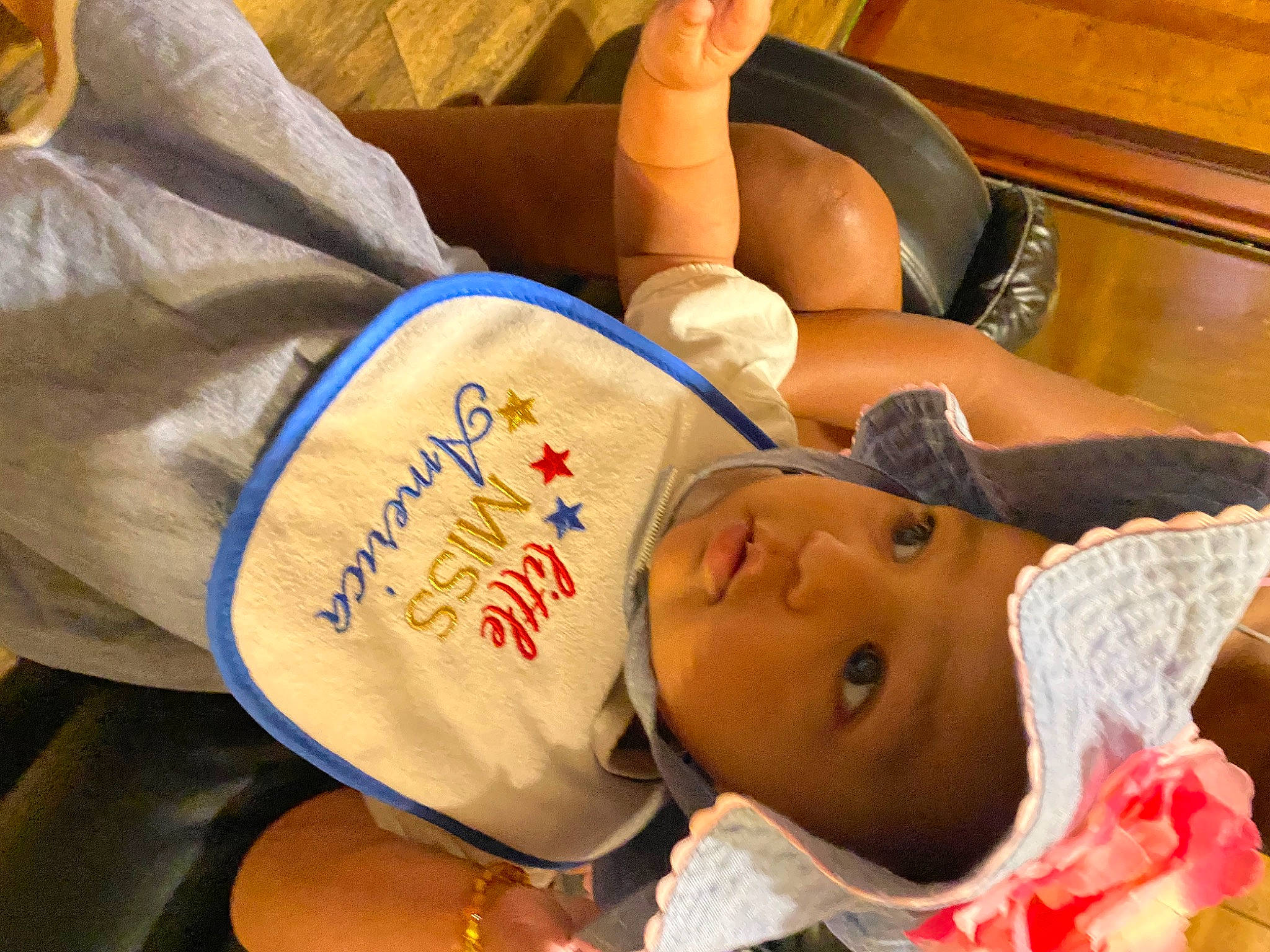 Lucille is registered to the contest to win money with this photo: abdomen, baby, bedtime, chest, child, comfort, couch, elbow, foot, handwriting, hat, headwear, human_leg, knee, mammal, nap, person, pillow, room, thigh