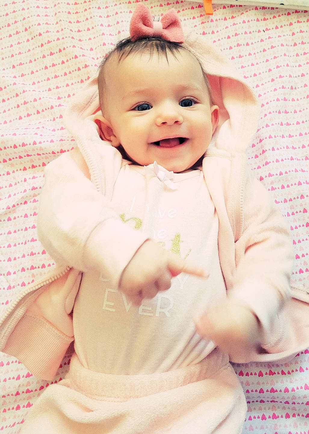 Kayli joined the competition — help win amazing prizes! baby, baby_laughing, baby_toddler_clothing, cheek, child, comfort, dress, eye, face, happy, head, joy, linens, lip, pattern, person, pink, skin, sleeve, smile