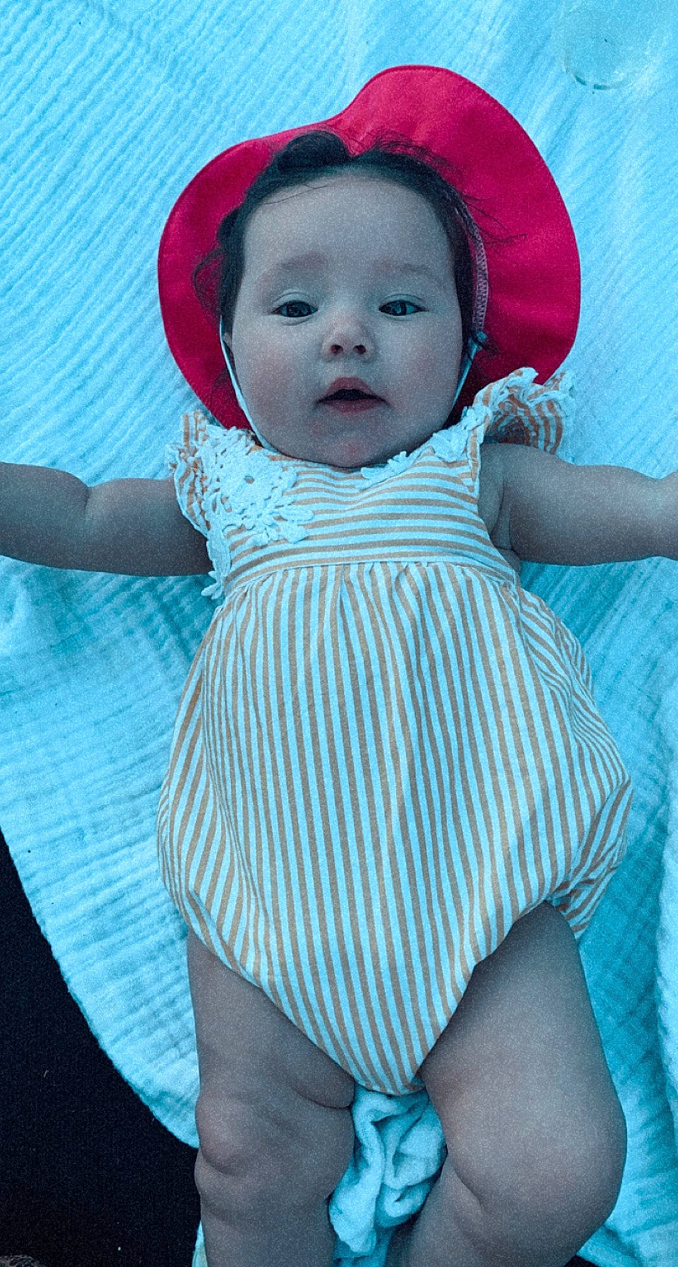Remmi is registered to the contest to win money with this photo: arm, azure, baby, baby_toddler_clothing, black, blue, cap, cheek, eye, lip, organ, outerwear, person, photograph, pink, purple, red, skin, sleeve, textile