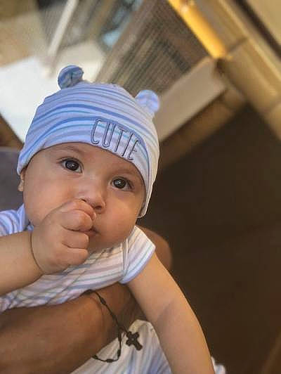 Kevin is registered to the contest to win money with this photo: baby, beanie, bonnet, cap, child, headgear, headwear, knit_cap, person, smile, toddler, vacation