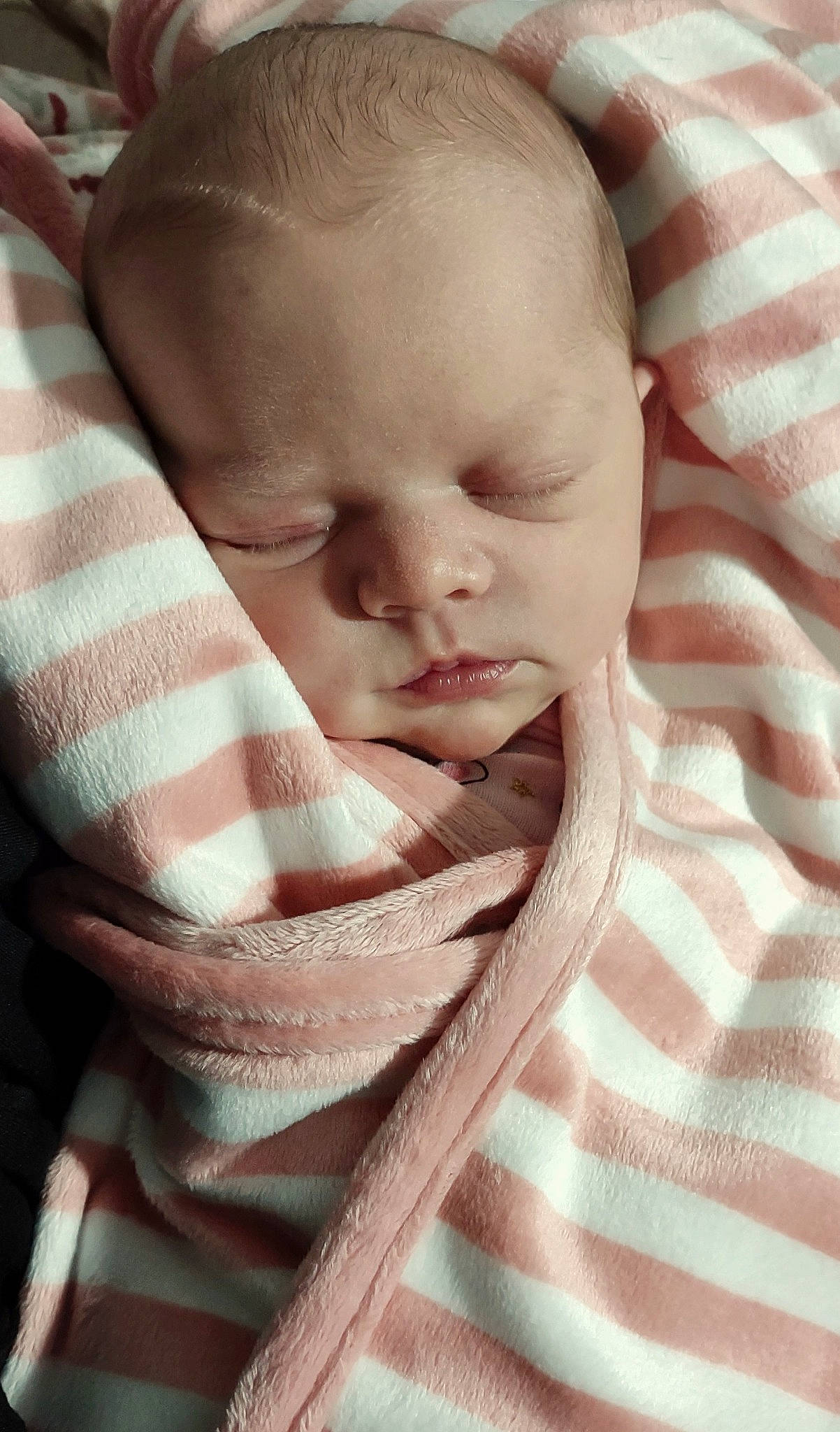 Saphira is registered to the contest to win money with this photo: baby, baby_products, baby_toddler_clothing, cheek, child, comfort, ear, linens, person, room, sitting, skin, sleeve, thumb, toddler, wrinkle