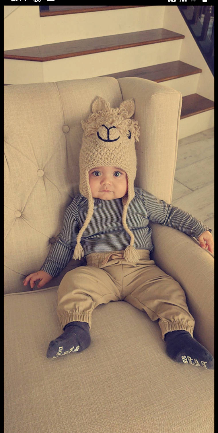 Harlan is registered to the contest to win money with this photo: art, cap, child, doll, eye, fashion_design, fawn, foot, fur, head, headwear, human_body, outerwear, pattern, person, room, sleeve, textile, toy, vintage_clothing