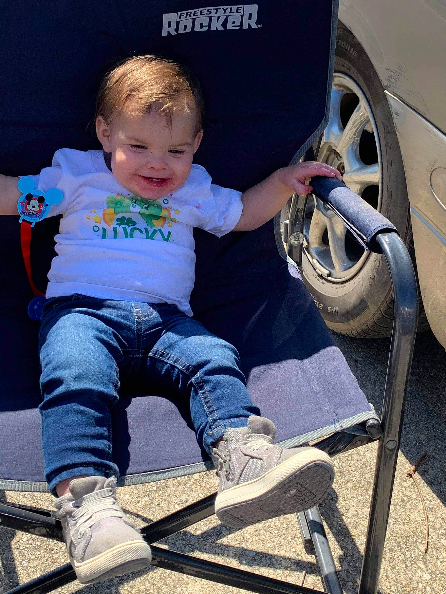 Bradley is registered to the contest to win money with this photo: alloy_wheel, automotive_lighting, automotive_tire, baby_toddler_clothing, blue, car, cool, eye, footwear, hairstyle, happy, jeans, joy, leg, person, product, shoe, smile, sneakers, tire