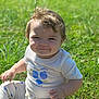 Bethany is registered to the contest to win money with this photo: child, toddler, grass, outdoor, sunlight, smile, white_clothing, blue_prints, happy, cute, sitting, baby, nature, greenery, portrait, casual, daylight, young_child, fun, playful