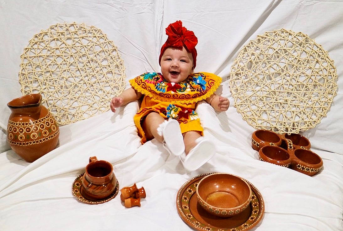 Kaidence is registered to the contest to win money with this photo: baby, baby_toddler_clothing, baked_goods, basket, cake, cake_decorating, chair, costume_hat, cuisine, dish, dishware, event, food, happy, hat, headgear, headwear, joy, person, plate