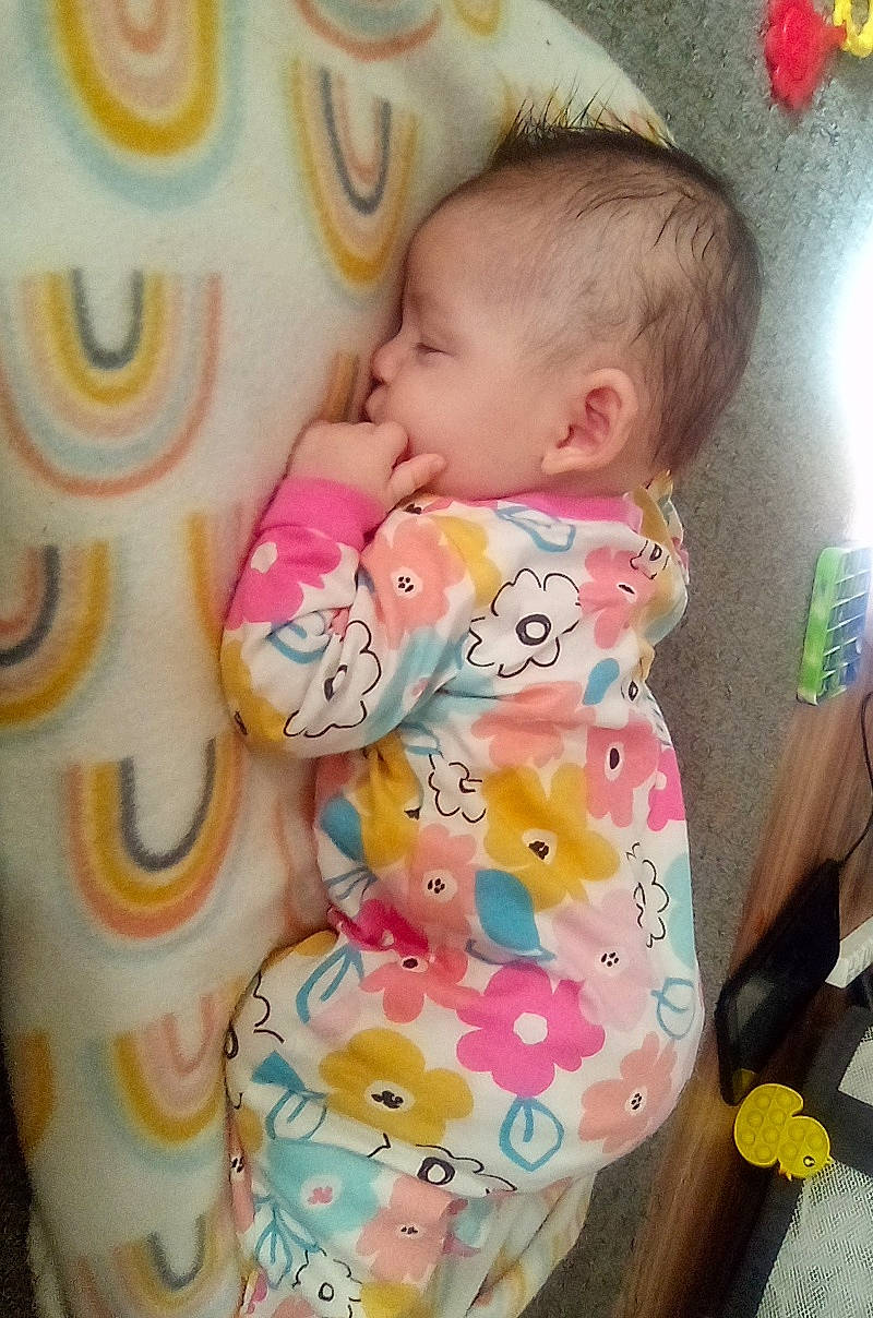 Ariall Skiiy is registered to the contest to win money with this photo: baby, baby_products, baby_toddler_clothing, cheek, child, comfort, eye, face, finger, happy, head, linens, organ, person, pink, product, skin, sleeve, textile, toddler