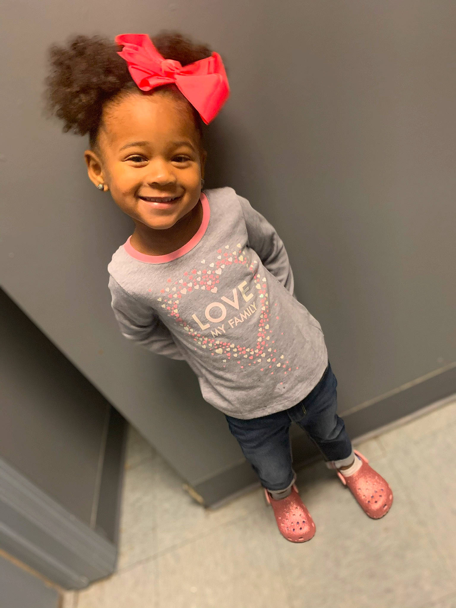 Maliah joined the competition — help win amazing prizes! child, facial_expression, floor, fun, happy, joy, person, photography, pink, play, smile, standing, t_shirt, toddler