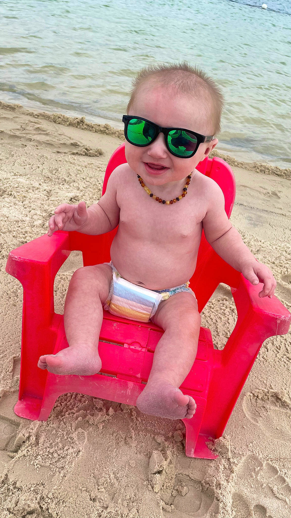 Jackson joined the competition — help win amazing prizes! baby_toddler_clothing, beach, eyewear, foot, fun, glasses, goggles, happy, human_leg, leg, leisure, magenta, person, pink, shorts, smile, sunglasses, thigh, toddler, vision_care