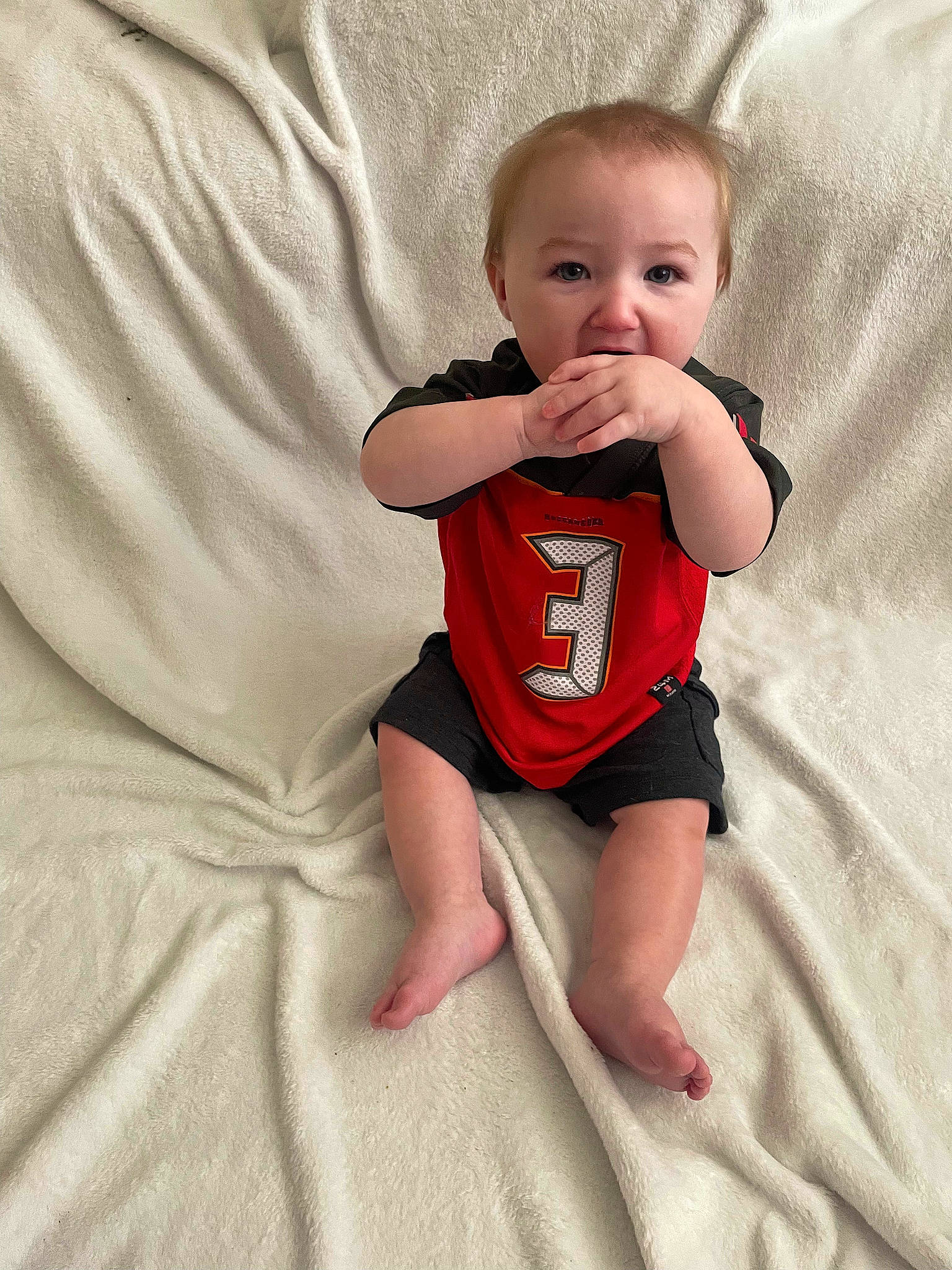 Jackson is registered to the contest to win money with this photo: arm, baby, baby_toddler_clothing, cheek, comfort, elbow, eye, face, finger, gesture, hand, happy, knee, neck, person, skin, sleeve, smile, stomach, thigh